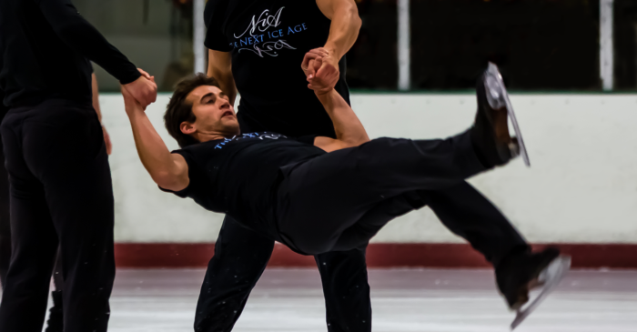 Ryan Bradley is lifted in Men Skating's Javelin