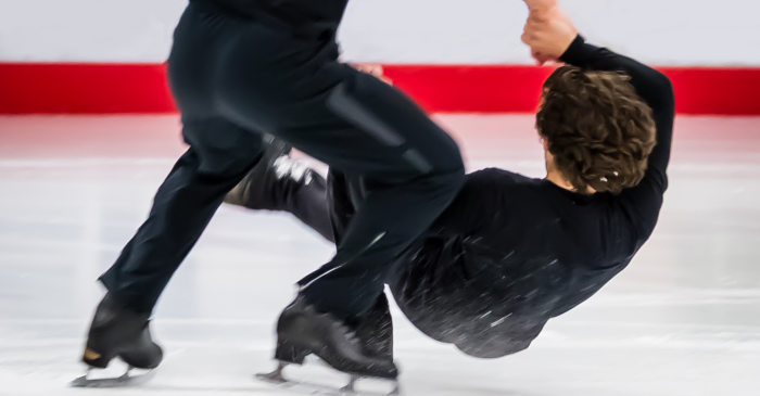 Ryan Bradley is lifted in Men Skating's Javelin